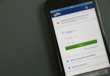 Elevvården utestängd från Wilma – kommuner i samma välfärdsområde ger olika rättigheter en telefon som visar Wilmas inloggningssida